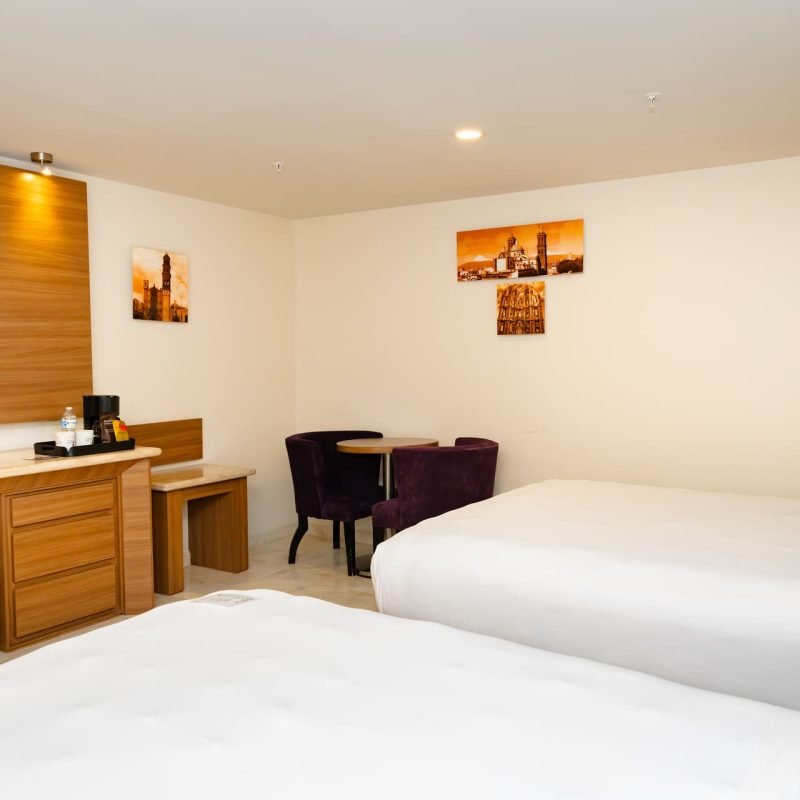 Habitación Encanto Esencial en Hotel JF Grand Puebla, diseño íntimo y confortable